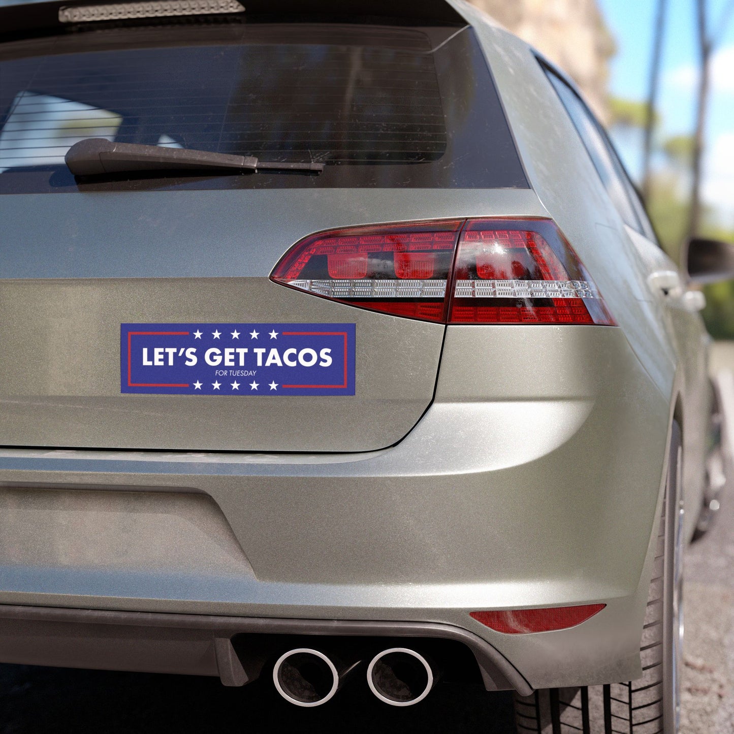 Political Humor Car Magnet - Let's Get Tacos with white text and stars on blue background displayed on car rear panel