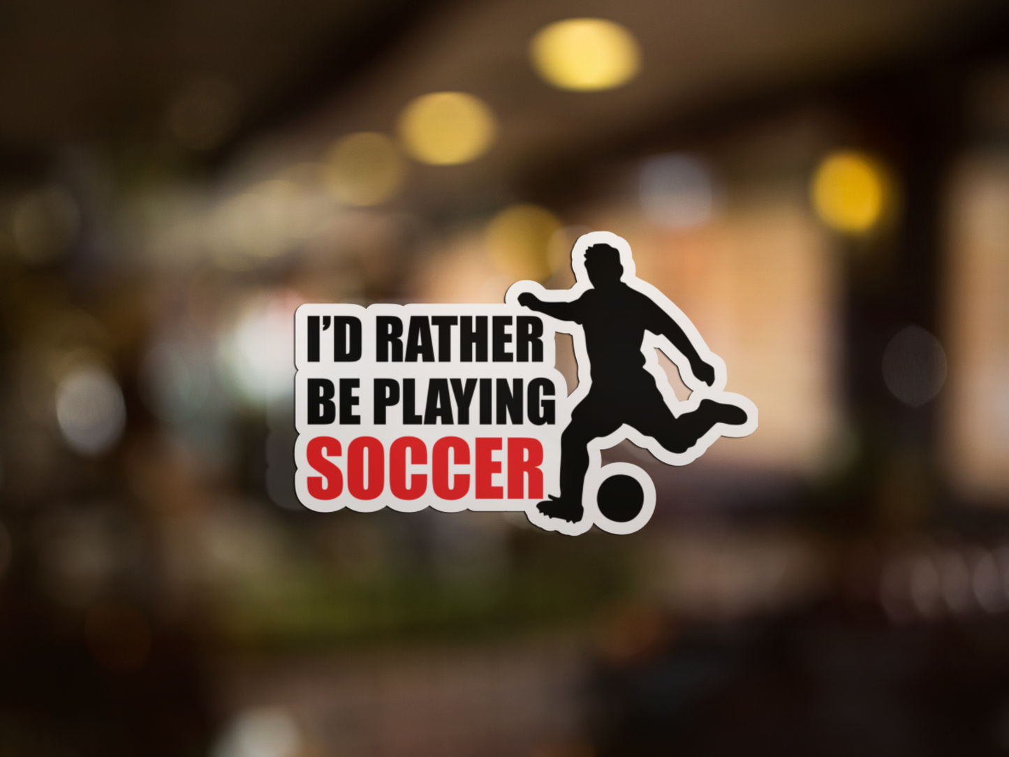 Kiss Sticker - Soccer with silhouette of player kicking ball and bold text saying I’d rather be playing soccer