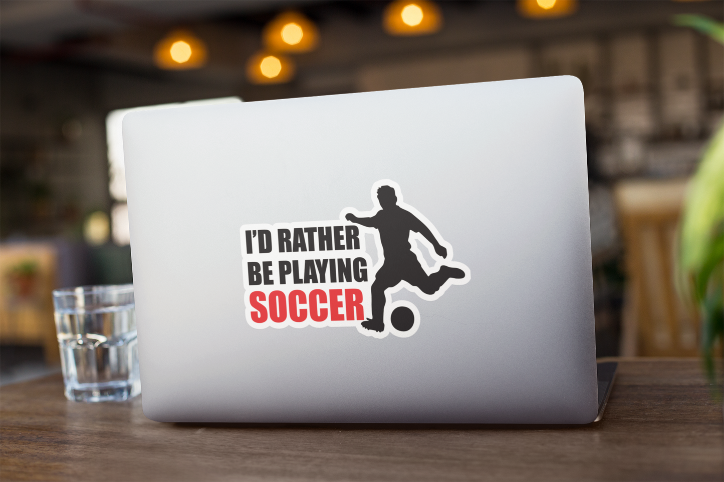 Kiss Sticker - Soccer featuring a black player silhouette kicking a ball with bold text in red and black